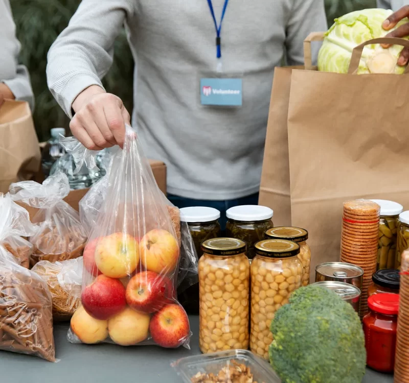 close-up-volunteers-collecting-food